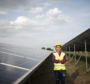 Engineer electric woman checking and maintenance of solar cells.